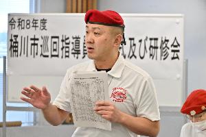 日本ガーディアン・エンジェルスの小田啓二理事長が講演をしている写真